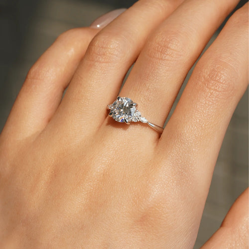 Close-Up of Round Cut Moissanite with Accent Stones