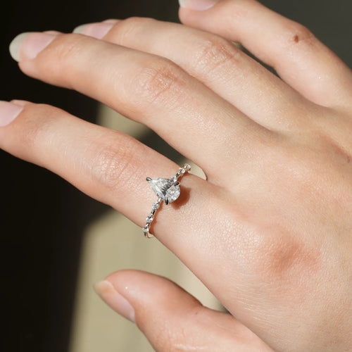 Pear Moissanite Ring with Hidden Halo on Hand Model
