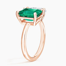 Load image into Gallery viewer, Close-up of rose gold moissanite and emerald gemstone ring
